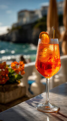 Aperol spritz with condensation on a seaside bar counter