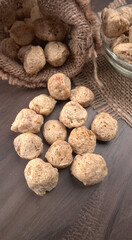 Raw soya chunks on dark background. Healthy, nutritious soybean meat, chunks isolated.Vegan food concept.