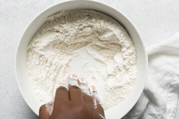 top view of mantou dough being mixed, process of making steamed buns