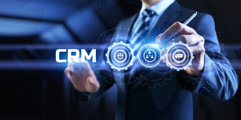 CRM Customer relationship management concept. Businessman pressing button on screen.