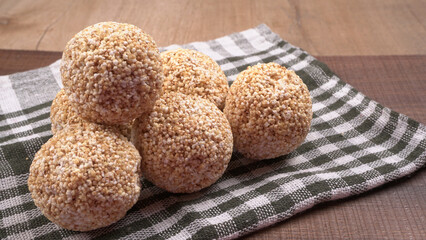 Amarnath seed, Cholai or Rajgira laddo, Also in cube shape called chikki or cake form, Indian sweet and healthy food served in a plate and bowl. Selective focus.