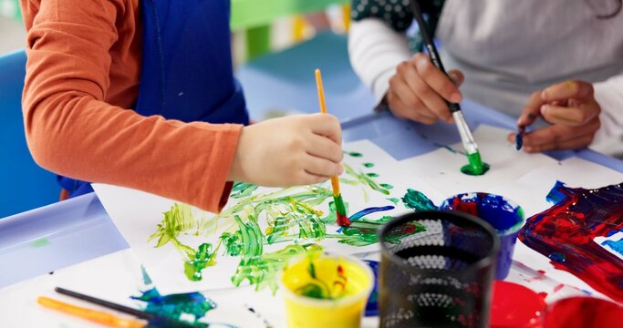 Education, hands and children with painting for kindergarten, creativity or skills development. Closeup, drawing and kids as students for artwork project, learning or motor growth with brush in class