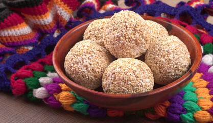 Amarnath seed, Cholai or Rajgira laddo, Also in cube shape called chikki or cake form, Indian sweet and healthy food served in a plate and bowl. Selective focus.