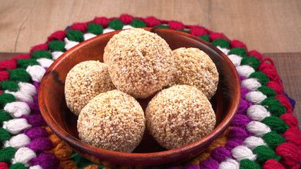 Amarnath seed, Cholai or Rajgira laddo, Also in cube shape called chikki or cake form, Indian sweet and healthy food served in a plate and bowl. Selective focus.
