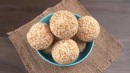 Amarnath seed, Cholai or Rajgira laddo, Also in cube shape called chikki or cake form, Indian sweet and healthy food served in a plate and bowl. Selective focus.