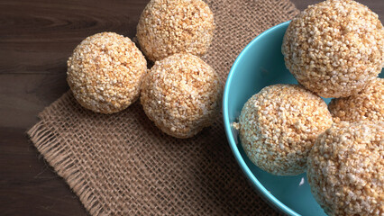 Amarnath seed, Cholai or Rajgira laddo, Also in cube shape called chikki or cake form, Indian sweet and healthy food served in a plate and bowl. Selective focus.