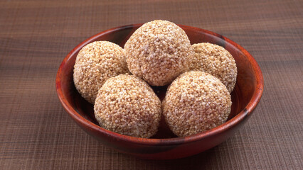 Amarnath seed, Cholai or Rajgira laddo, Also in cube shape called chikki or cake form, Indian sweet and healthy food served in a plate and bowl. Selective focus.