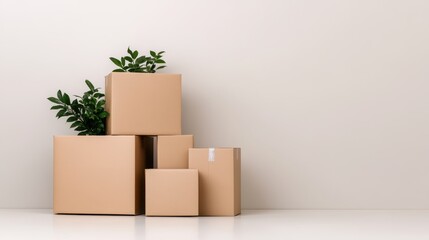 A collection of eco-friendly cardboard boxes is artistically arranged with green plants, illustrating sustainable living concepts while providing a calm and organized aesthetic.