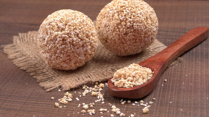 Amarnath seed, Cholai or Rajgira laddo, Also in cube shape called chikki or cake form, Indian sweet and healthy food served in a plate and bowl. Selective focus.