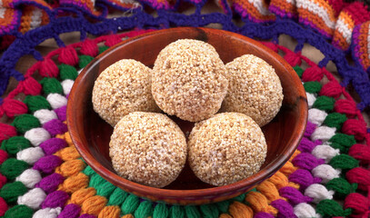 Amarnath seed, Cholai or Rajgira laddo, Also in cube shape called chikki or cake form, Indian sweet and healthy food served in a plate and bowl. Selective focus.