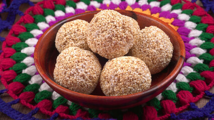 Amarnath seed, Cholai or Rajgira laddo, Also in cube shape called chikki or cake form, Indian sweet and healthy food served in a plate and bowl. Selective focus.