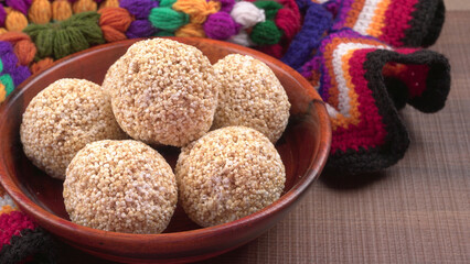 Amarnath seed, Cholai or Rajgira laddo, Also in cube shape called chikki or cake form, Indian sweet and healthy food served in a plate and bowl. Selective focus.