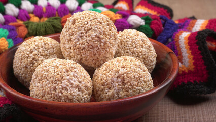 Amarnath seed, Cholai or Rajgira laddo, Also in cube shape called chikki or cake form, Indian sweet and healthy food served in a plate and bowl. Selective focus.