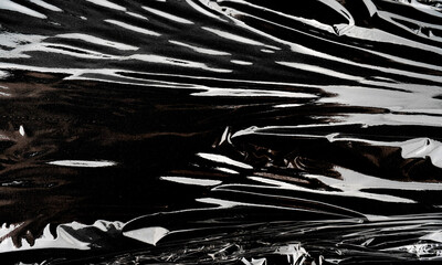 Abstract black and white textures with fluid patterns.