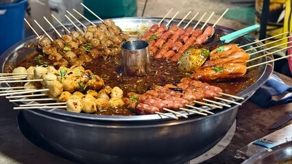 Colorful Array of Grilled Skewers and Sauces at Outdoor Food Market, A Gastronomic Delight