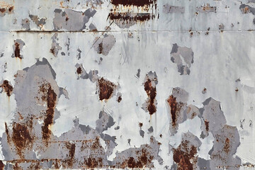 Peeling Paint and Rust on Weathered Metal Surface