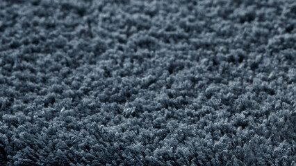Textured dark blue fabric close-up showcasing softness and depth, perfect for interior design and home decor ideas.
