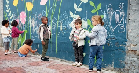Kindergarten, children and drawing with chalk on mural wall for fun outdoor activity on playground. Kids, group or creative youth with art for childhood development or growth at elementary school