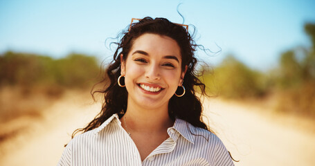 Happy, nature and portrait of woman in desert for vacation, getaway or weekend trip outdoor. Smile, confident and face of female person from Mexico for holiday with sightseeing, journey or adventure.