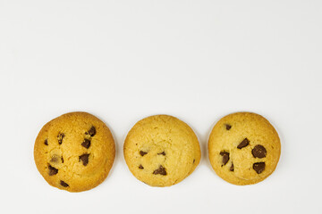 Chocolate chip cookies, isolated close-up on a white background with copy space