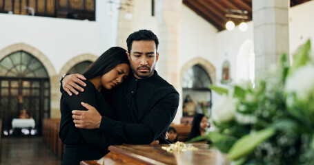 Coffin, comfort and couple mourning at funeral in church for respect, support or hug for loss together. Sad man, woman and grief at memorial service with casket for goodbye, rip or console for death