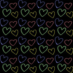 Seamless pattern with colorful hearts drawn in doodle style on a black background