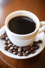 A steaming cup of black coffee rests on a saucer adorned with roasted coffee beans