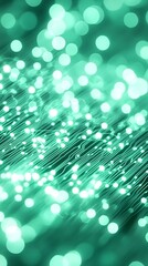 Abstract teal bokeh lights on dark background