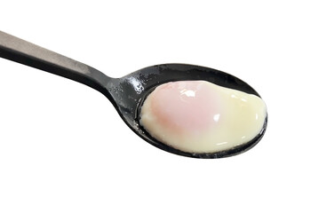 Perfectly poached egg resting on a spoon, isolated on a clean white background, showing soft yolk and tender egg white for cooking or nutrition themes.