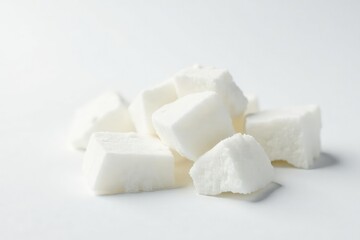 Lumps of refined white sugar against white backdrop, food, photography