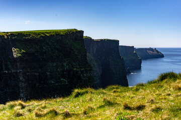 Majestic Cliffs Of Moher Rising Over The Atlantic Ocean In County Clare Ireland On A Clear Sunny Day