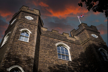 British castle with Union Jack under moody sky
