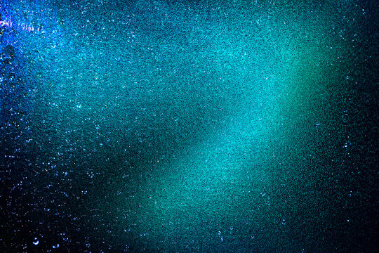 Black dark blue purple orange red shiny glitter abstract background with space. Twinkling glow stars effect. Like outer space, night sky, universe. Rusty, rough surface, grain.