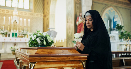 Mature woman, coffin and rose at funeral for farewell, mourning death and goodbye at burial...