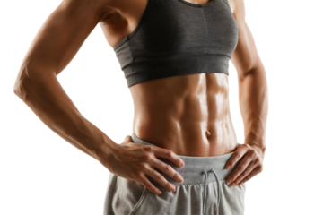 Close-up of a woman's toned and defined abs against black background, concept fitness, health, body image, and sports