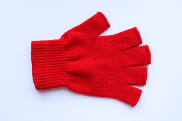 Red wool gloves isolated on white background. Knitted gloves for winter.