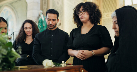 Sad, people or family with casket in funeral for farewell service, mourning death or grief. Church,...