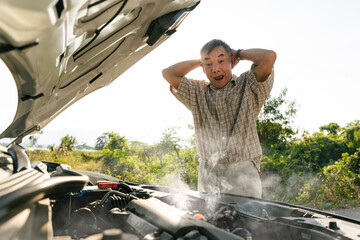 Elderly man shocked by smoking car engine breakdown