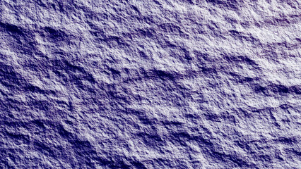 Close-up of a rough and weathered dark rock surface, texture of marble stone cut close up
