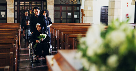 Memorial service, family and woman with grief, church and widow with flowers for funeral or...