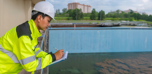 Environmental engineers work at wastewater treatment plants,Water supply engineering working at...