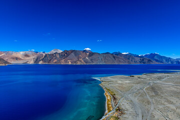 Landscape with mountains on the lake named Pagong Tso or Pagong Lake, situated on the border with...