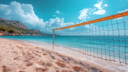 Beach Volleyball Net on Sandy Shore with Turquoise Ocean and Blue Sky