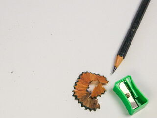 Pencil Sharpening Process: Close-up View of Stationery Supplies