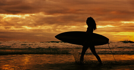 Silhouette, travel and person with surfboard, beach and journey for surfer on holiday, sunset or...