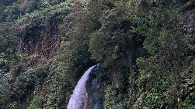 View of the Curug Cibeureum waterfall, West Java.
