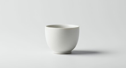 Isolated white ceramic cup on white background