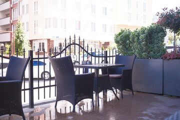 Charming Outdoor Cafe Seating Surrounded by Lush Greenery and a Relaxing Atmosphere