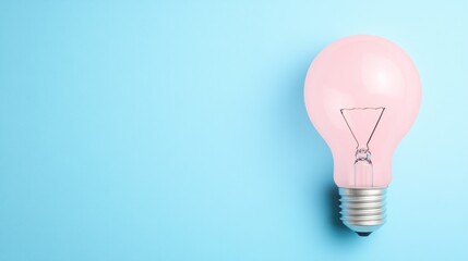 Pink Light Bulb on Blue Background: A Symbol of Ideas and Innovation