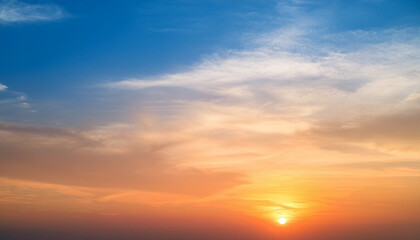 Fototapeta premium abstract gradient sunrise in the sky with cloud and blue mix orange natural background